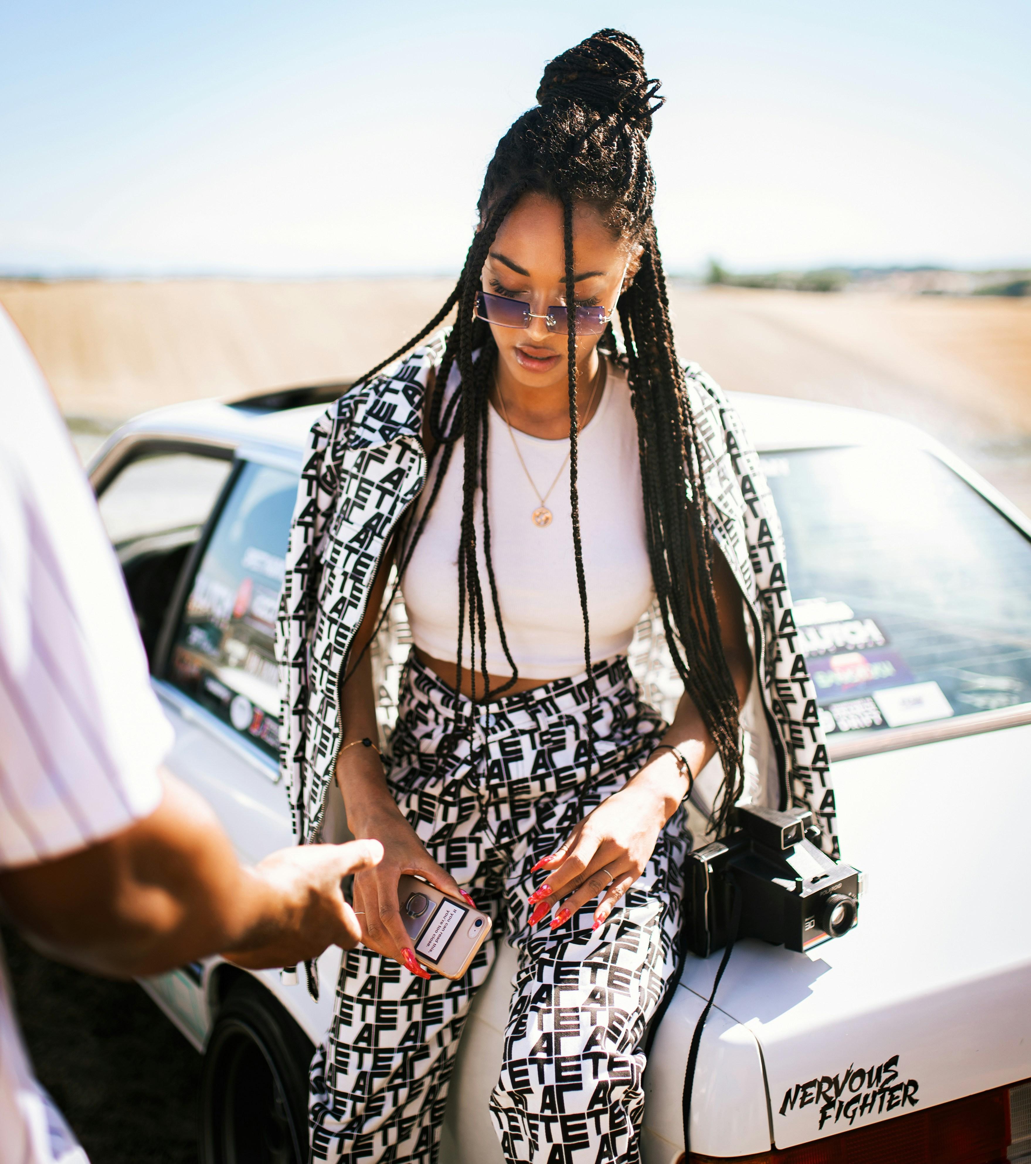 Woman wearing a bold streetwear set with a black and white pattern